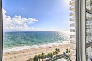 a view of the beach from the balcony of a building at Luxe Waterfront Ft Lauderdale Condo with Beach, Pool apts in Fort Lauderdale
