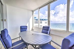 a table and chairs in a room with a view of the ocean at Luxe Waterfront Ft Lauderdale Condo with Beach, Pool apts in Fort Lauderdale +29 photos