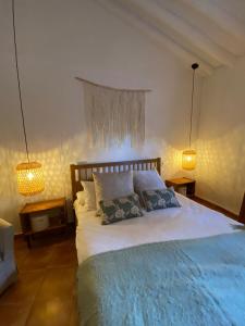 Postel nebo postele na pokoji v ubytování Acogedora Casa Rural en Olvera La Morada