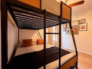 a bedroom with two bunk beds in a room at Lovely House II in Auburn