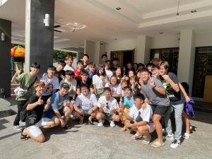 a group of young people posing for a picture at 40PAX 7BR Villa with Kids Swimming pool, KTV, Pool Table n BBQ near SPICE Arena Penang 9800 SQFT in Bayan Lepas