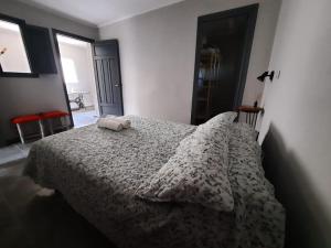 A bed or beds in a room at Departamento Los Nonos