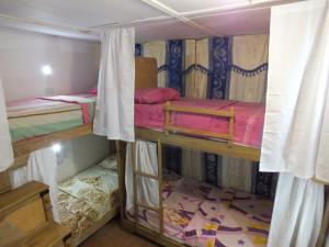 a couple of bunk beds in a room at Hotel Alto de los Nogales in Barranquilla