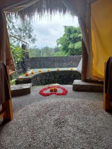 a room with a bunch of flowers on the ground at Geopark Village & Spa in Kintamani