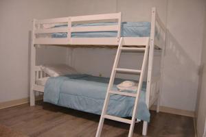 a couple of bunk beds in a room at Bright and Cozy Lighthouse Cottage in Greenville SC in Greenville