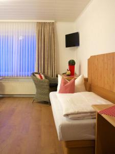 TV a/nebo společenská místnost v ubytování Hotel Ostermann