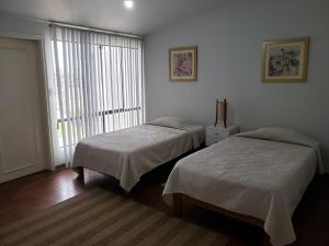 Кровать или кровати в номере Amplio y Acogedor Departamento en San Miguel, Lima