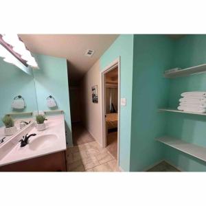 a bathroom with a sink and a mirror at North Little Rock Home Near Bases in North Little Rock