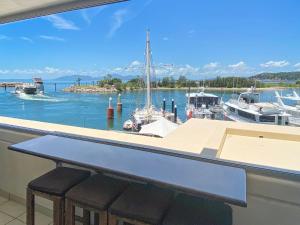 a view of a marina with boats in the water at Blue on Blue Superior Studio Room 1271 in Nelly Bay