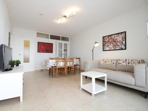 a living room with a couch and a table at Appartement T3 à Balaruc-les-Bains avec WiFi et vue sur l'étang de Thau - FR-1-553-188 in Balaruc-les-Bains