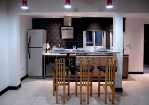 Kuchyň nebo kuchyňský kout v ubytování Ayres home VIP MODERNO SOLO ADULTOS CENTRICO