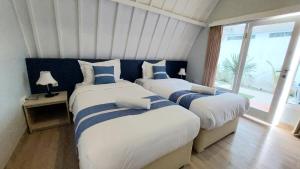 Una cama o camas en una habitación de Cosè Gili Beach Resort 33 fotos más