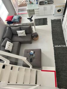 an overhead view of a living room with a couch at Cozy Corner Cottage in Langebaan