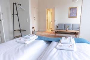 Postel nebo postele na pokoji v ubytování Hotel Harmonien