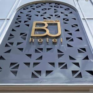 a sign on a building with the letter b on it at BJ city hotel in Surat Thani