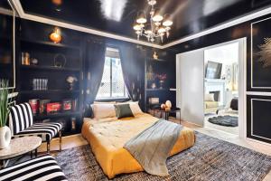 a bedroom with a bed and a table and chairs at Luxury Home - 7mins LAX/Beach, 405/SoFi nearby in Hawthorne