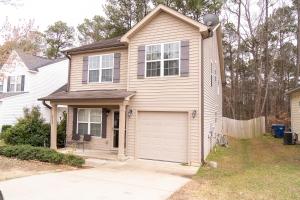 a house with a garage in a yard at Beautiful spacious 4 bedroom house , sleeps 8+ in Raleigh