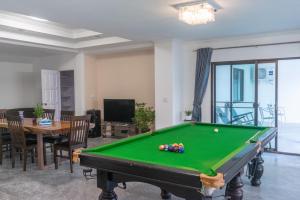 a living room with a pool table at wonderland2 village KTV pool villa in Pattaya North