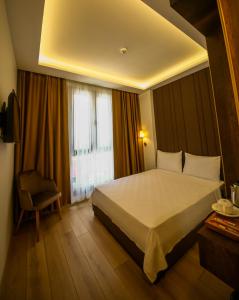 Katil atau katil-katil dalam bilik di ALKAN PALACE HOTEL