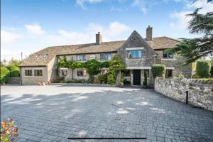 a large stone house with a stone driveway at Poplars Cottage Luxury Detached Home With Outbuildings - Nr Bristol & Bath 