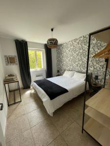 Posteľ alebo postele v izbe v ubytovaní La Luberonne gordes