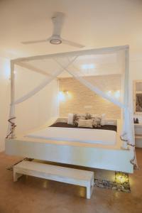 Postel nebo postele na pokoji v ubytování Kirinuga Boutique Retreat