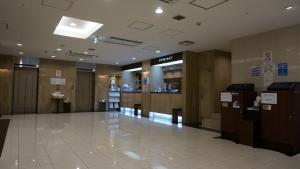 a lobby of a building with a waiting room at Osaka Teikoku Hotel in Osaka