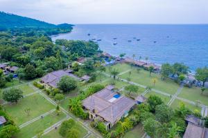 an aerial view of a house next to the water at Amertha Bali Villas in Pemuteran