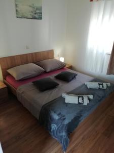 Postel nebo postele na pokoji v ubytování Apartman Ines