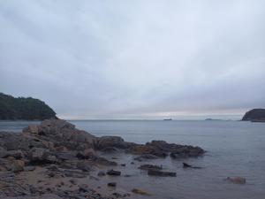 a group of rocks in the water on a beach at Club Lespia in Taean in Taean