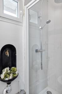 a bathroom with a shower and a sink and a toilet at Au coeur du triangle d'or de Versailles in Versailles +7 photos
