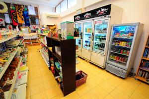 a grocery store aisle with a refrigerator and a grocery store at Alina Grande Hotel & Resort in Ko Chang
