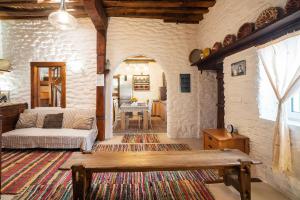 a living room with a couch and a table at Mannas House in Émbonas