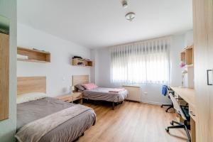 Postel nebo postele na pokoji v ubytování Micampus Logroño Student Residence