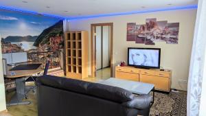 En TV eller et underholdningssystem på HYGGE Apartment CONTACTLESS CHECK-IN