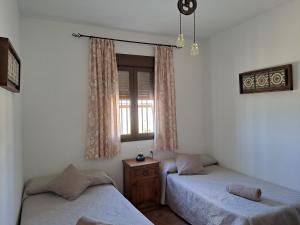 A bed or beds in a room at Mirador del Sotillo