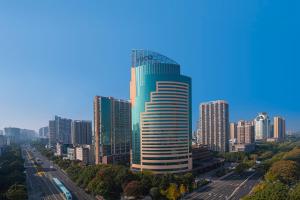 a tall building in the middle of a city at voco Changzhou Fudu in Changzhou