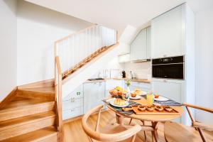 a kitchen with a table with food on it at Casa das Andorinhas - 1 bedroom apartment sleeps 4 in Câmara de Lobos