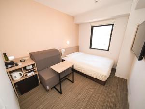 Postel nebo postele na pokoji v ubytování Super Hotel Shonan Fujisawaeki Minamiguchi
