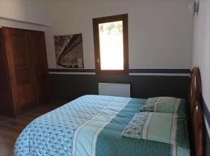 Postel nebo postele na pokoji v ubytování Appartement avec vue sur la montagne