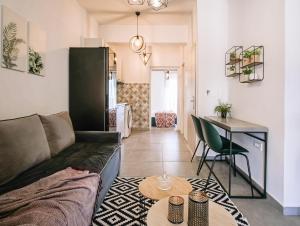 a living room with a couch and a table at Miriam's Apartment 2 in Zakynthos