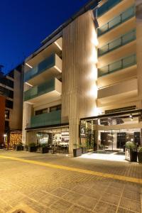 a large building with a courtyard in front of it at S Hotel Boutique Thessaloniki in Thessaloniki