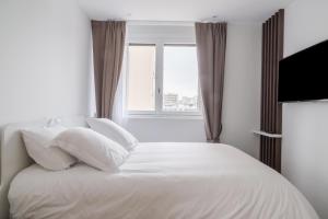 Posteľ alebo postele v izbe v ubytovaní Fauriel Paul - Appartement moderne et spacieux