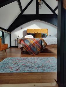 a bedroom with a bed and a rug at Slateford House 1770 by The House of Danu in Edinburgh