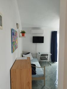 a living room with a couch and a table at Apartments Davor in Drage