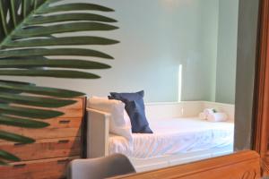 a childs bedroom with a bed and a plant at Terracotta House in Bristol