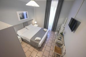 A bed or beds in a room at Affittacamere Berzi