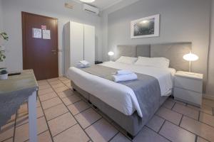 A bed or beds in a room at Affittacamere Berzi