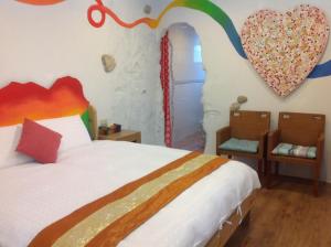 Postel nebo postele na pokoji v ubytování Kenting Sun & Sea B&B + 6 fotografií