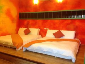Postel nebo postele na pokoji v ubytování Kenting Sun & Sea B&B